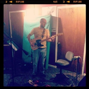 Evan Thompson, playing lead guitar on a tracking session for Parker's Mercy Brigade by Kristen Gilles