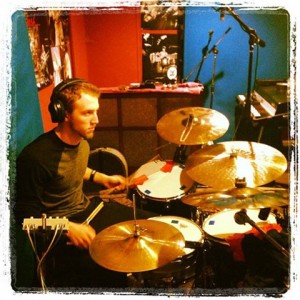 Jared Hoffman playing drums during a recording session for Parker's Mercy Brigade by Kristen Gilles