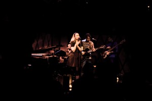 Singer-songwriter Melanie Penn performing live on stage