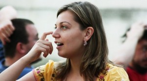 Woman scratching her nose