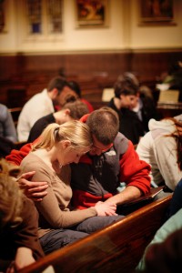 A husband and wife pray together at Sojourn Church vision meeting