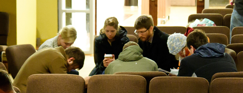 Christians praying in a small group prayer meeting at Sojourn Community Church in Louisville