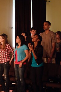 Christian worshipers singing, praising God, raising hands at Sojourn Midtown in Louisville. Photo courtesy Tom Branch