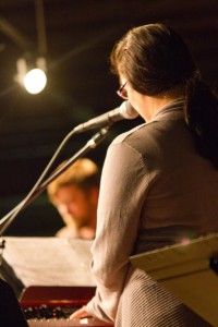 Kristen Gilles playing piano. Kristen pays careful attention to lyrics when composing music