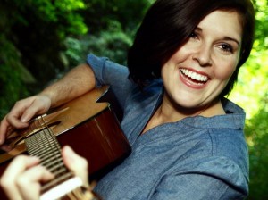 Closeup of Kristen Gilles playing guitar, photo by Kaiti Bierdeman