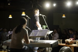 Kristen Gilles playing keyboard with the Sojourn Music band during live worship