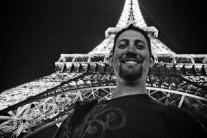 Sojourn's 6'6" inch Pastor Daniel Wainright doesn't look so tall next to the Eiffel Tower, on this European mission trip