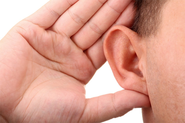 photo of an ear, with a hand cupping it, as if listening intently