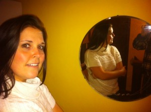 Kristen Gilles in front of a mirror, proving she isn't a vampire