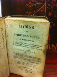 1822 Edition of Isaac Watts Hymnal along with CD cover of Sojourn's Over The Grave: The Hymns of Isaac Watts, Volume One